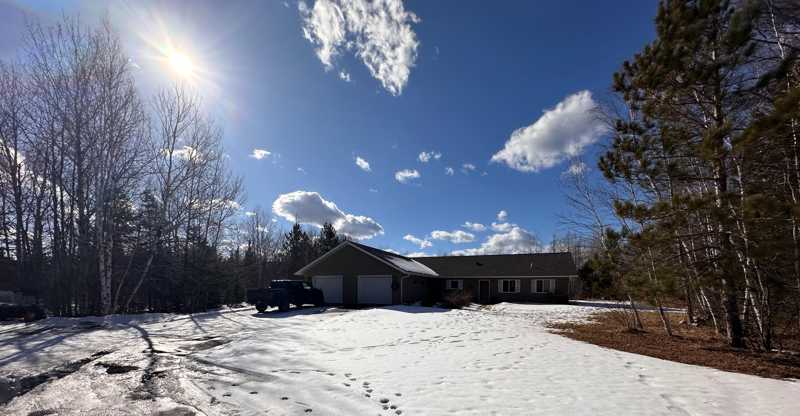 Hannah and Erik's family home nestled among trees in Northern Minnesota